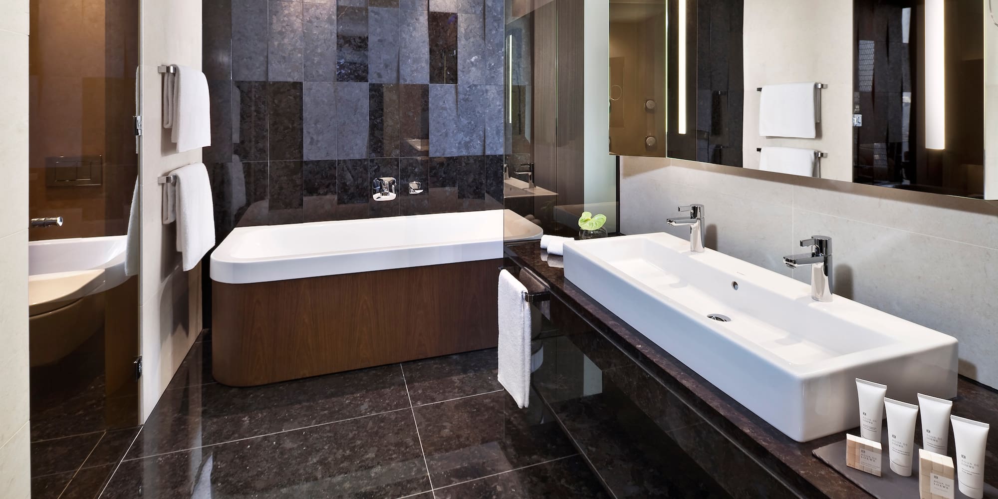 a bathroom with a bathtub and a mirror