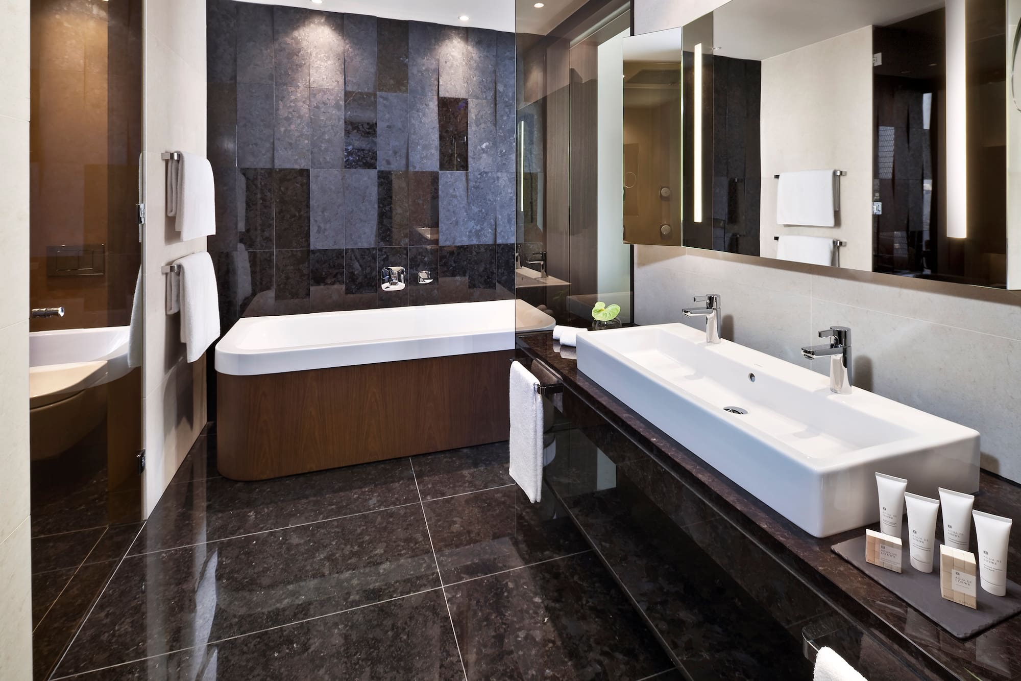 a bathroom with a bathtub and a mirror