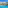 White resort hotel, large swimming pool, palm trees, and sun loungers.