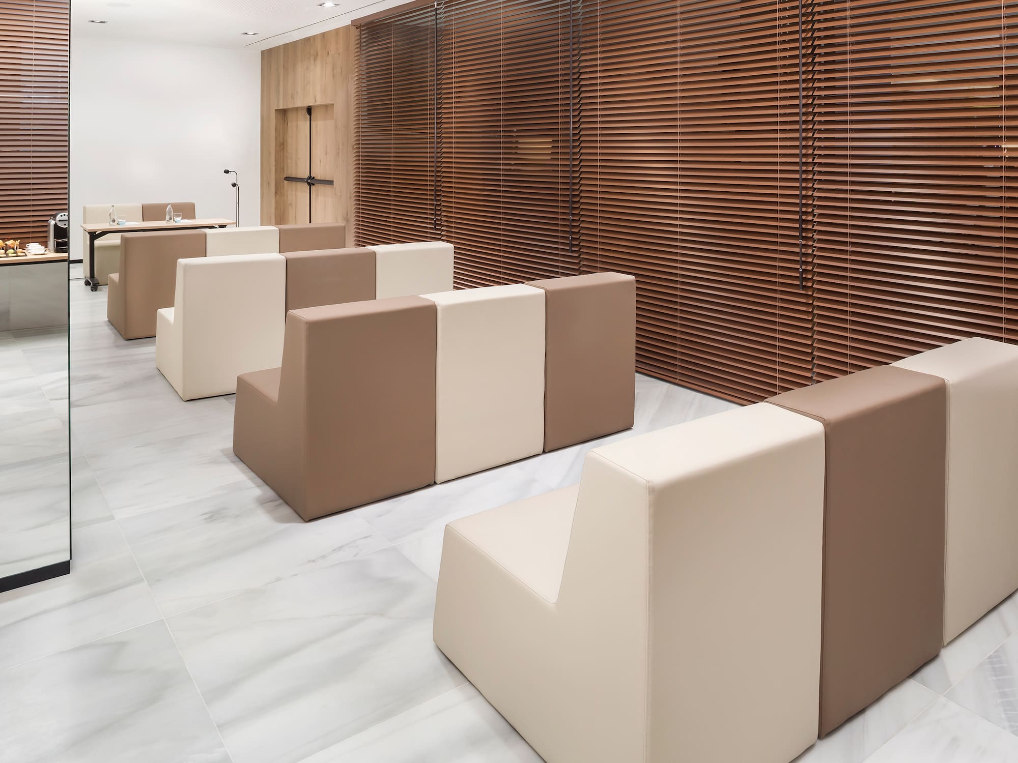 a room with white and brown chairs