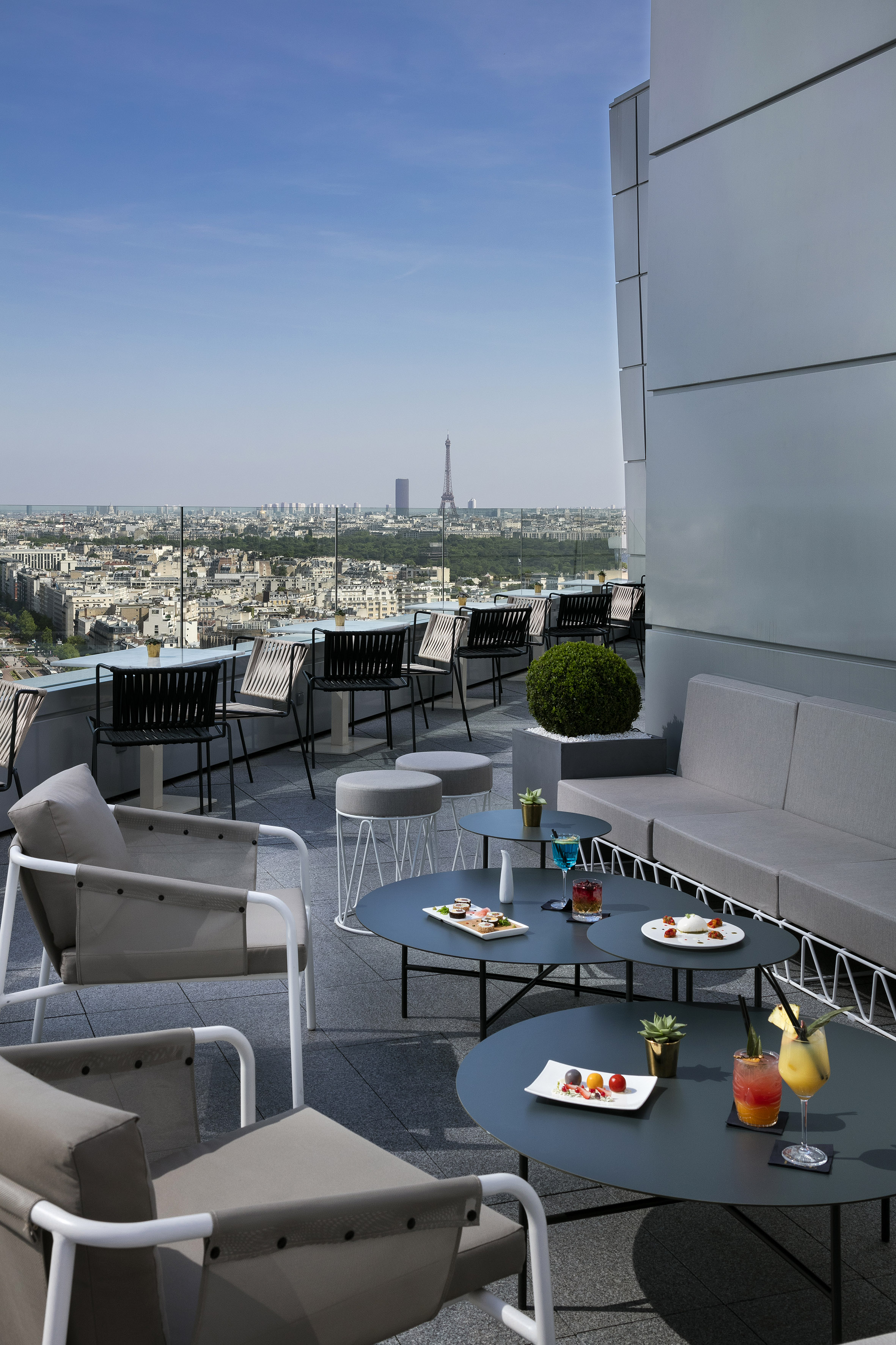a rooftop patio with a view of a city