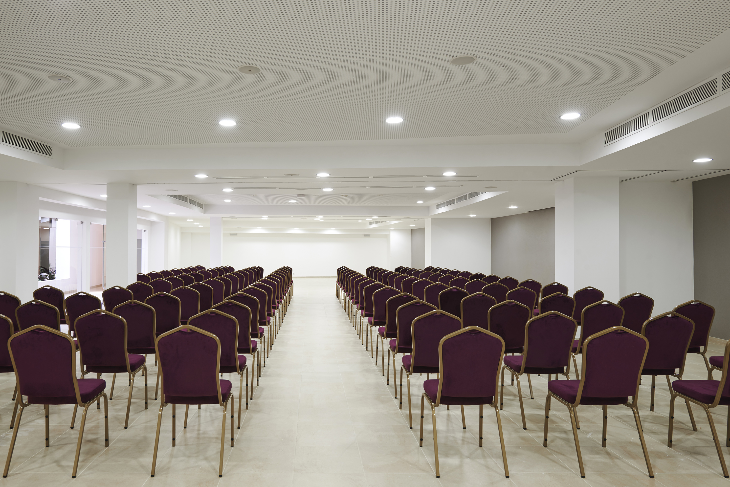 rows of purple chairs in a room