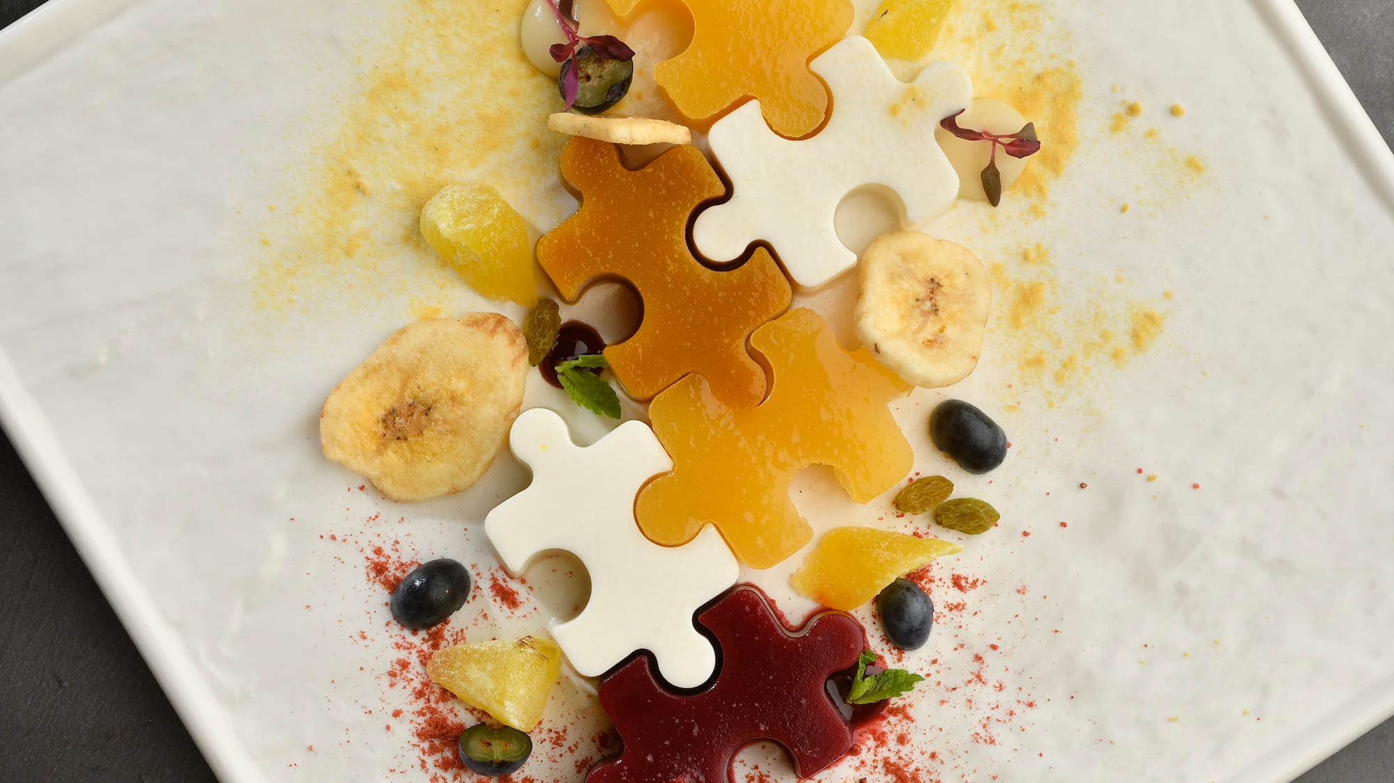 a plate of food with pieces of puzzle