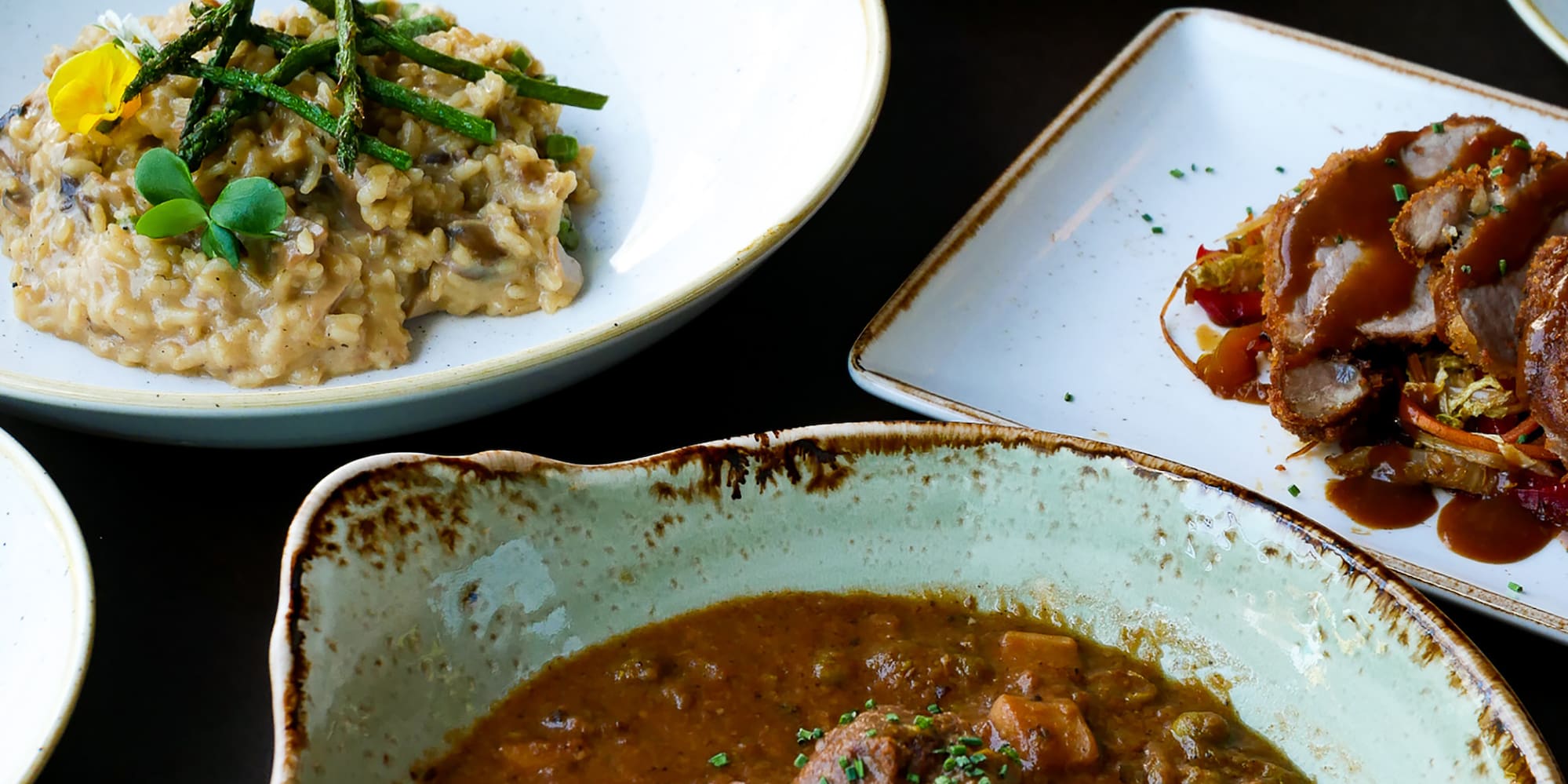 a table full of plates of food