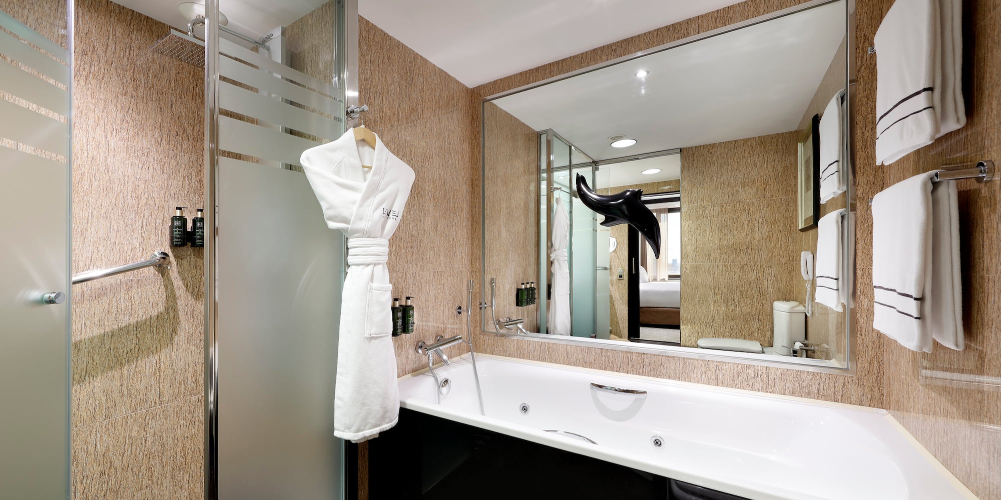 a bathroom with a bathtub and a shower