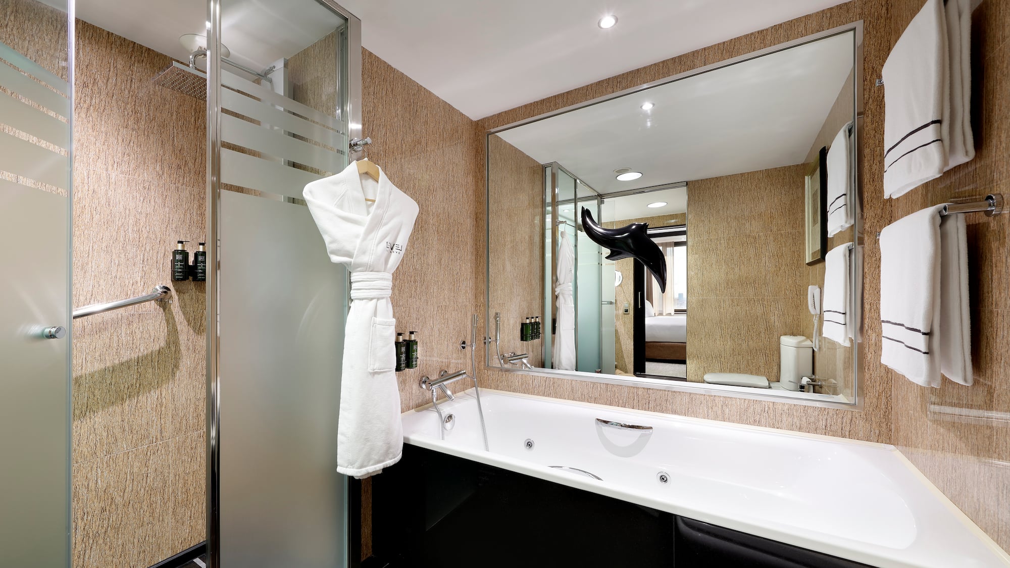 a bathroom with a bathtub and a shower