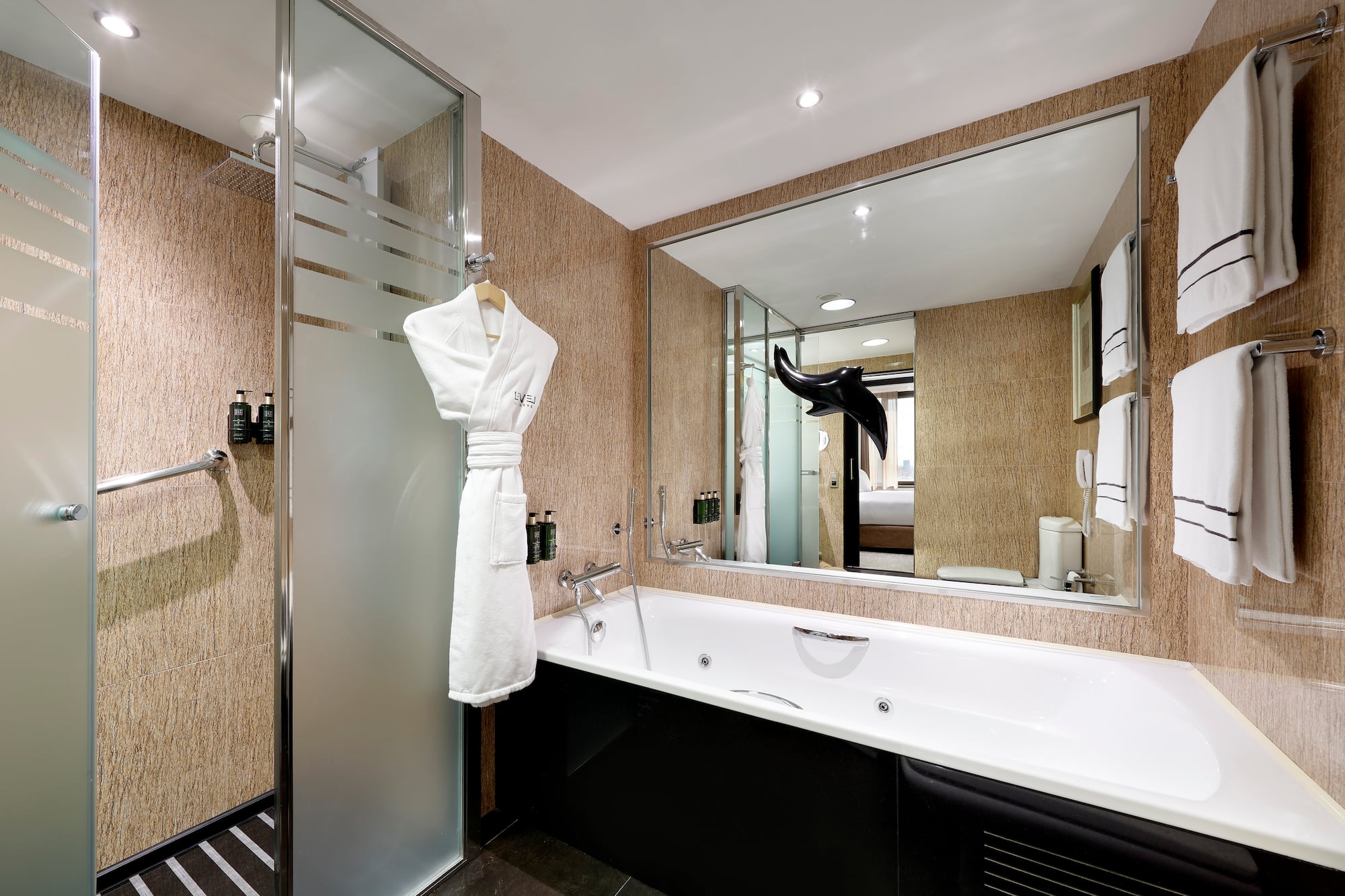 a bathroom with a bathtub and a shower