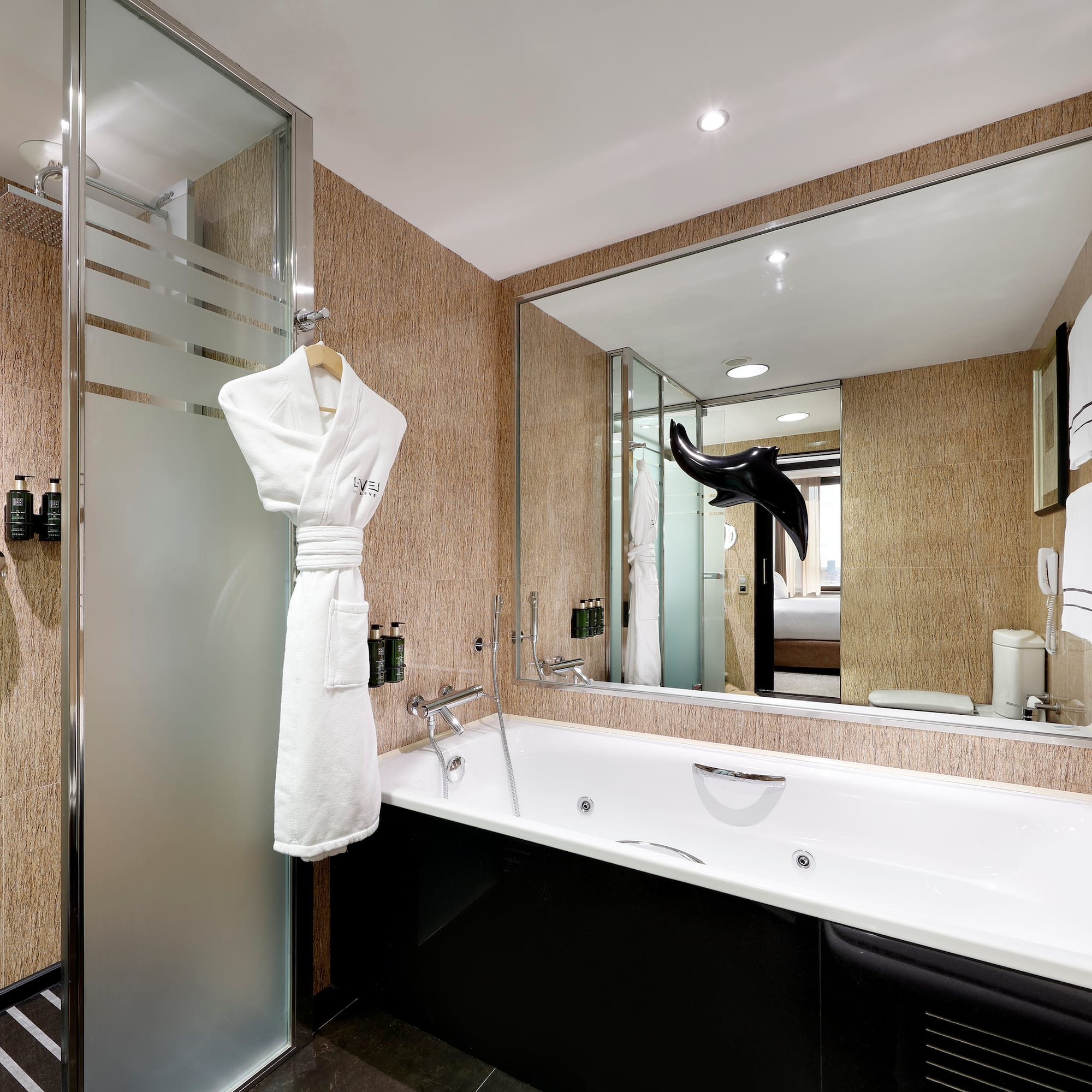 a bathroom with a bathtub and a shower