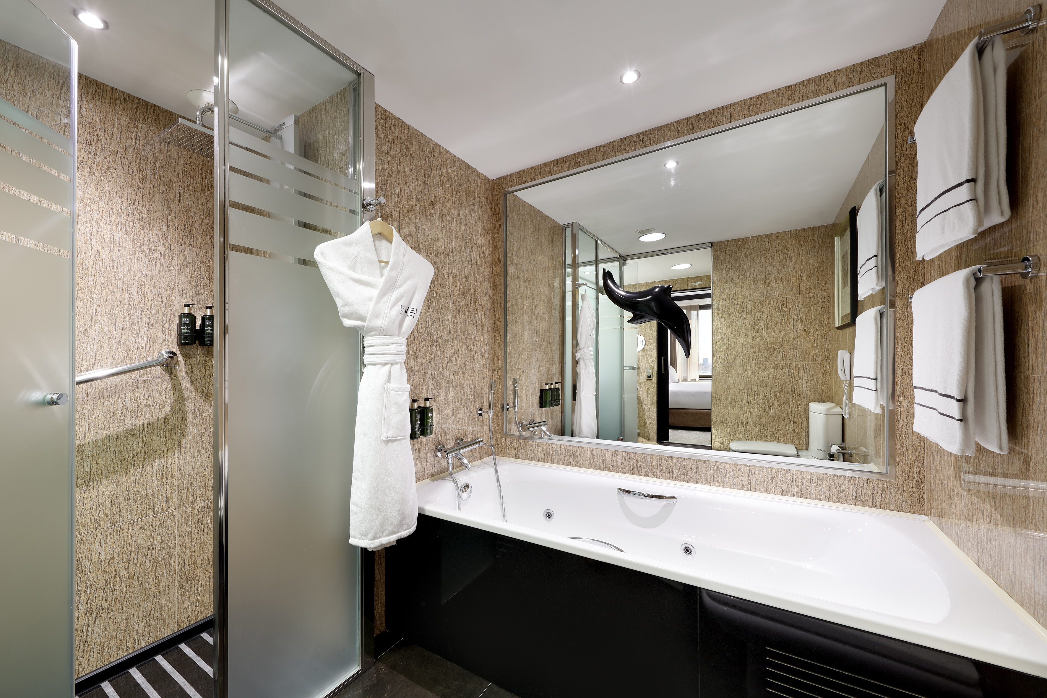 a bathroom with a bathtub and a shower