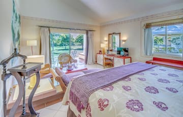 a bedroom with a bed and a desk