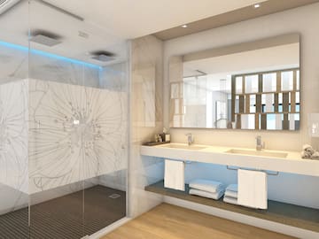 a bathroom with a shower and sink