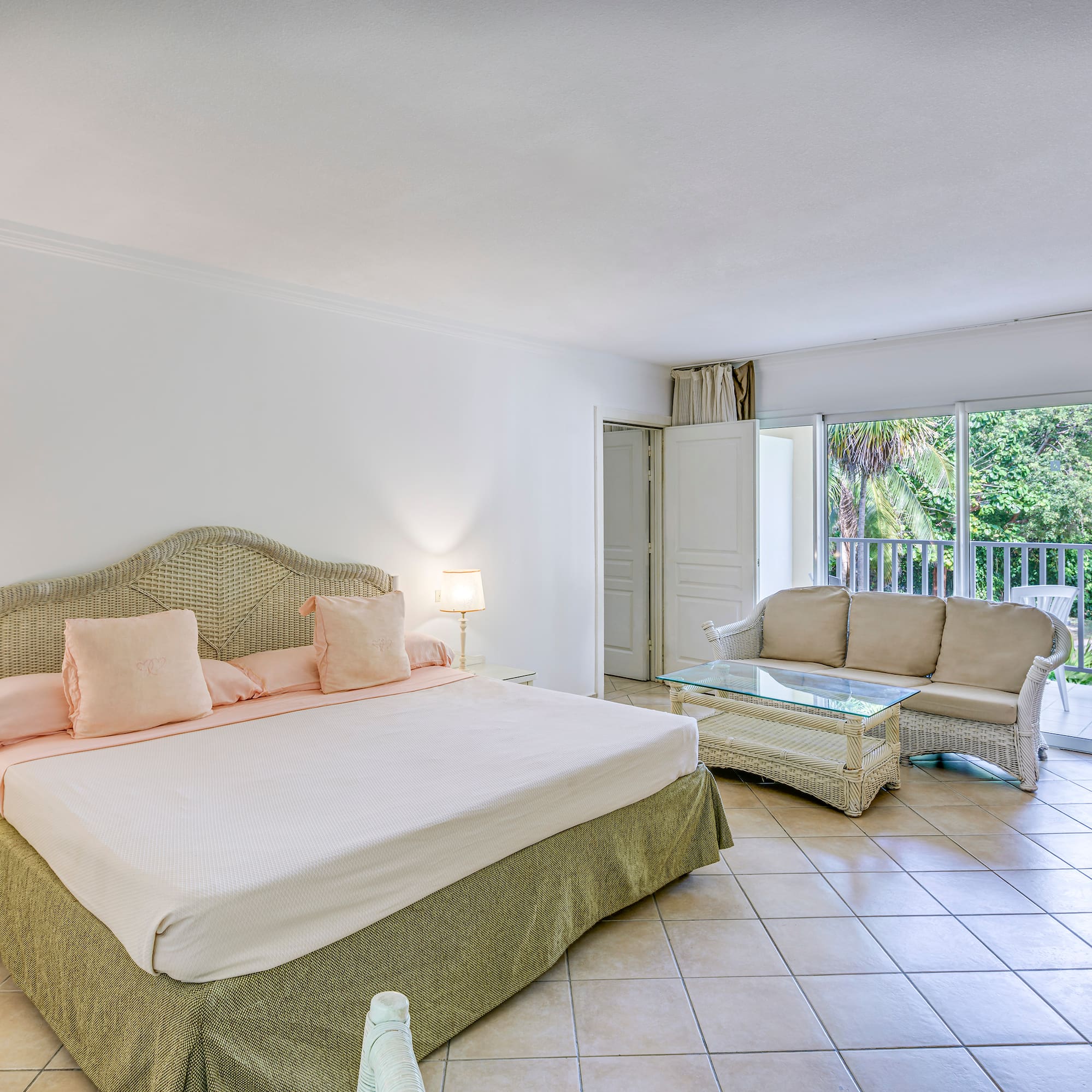 a bedroom with a bed and a couch