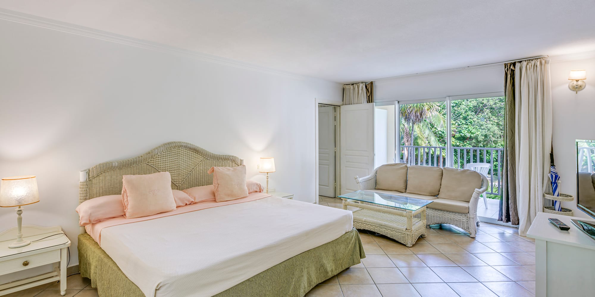 a bedroom with a bed and a couch