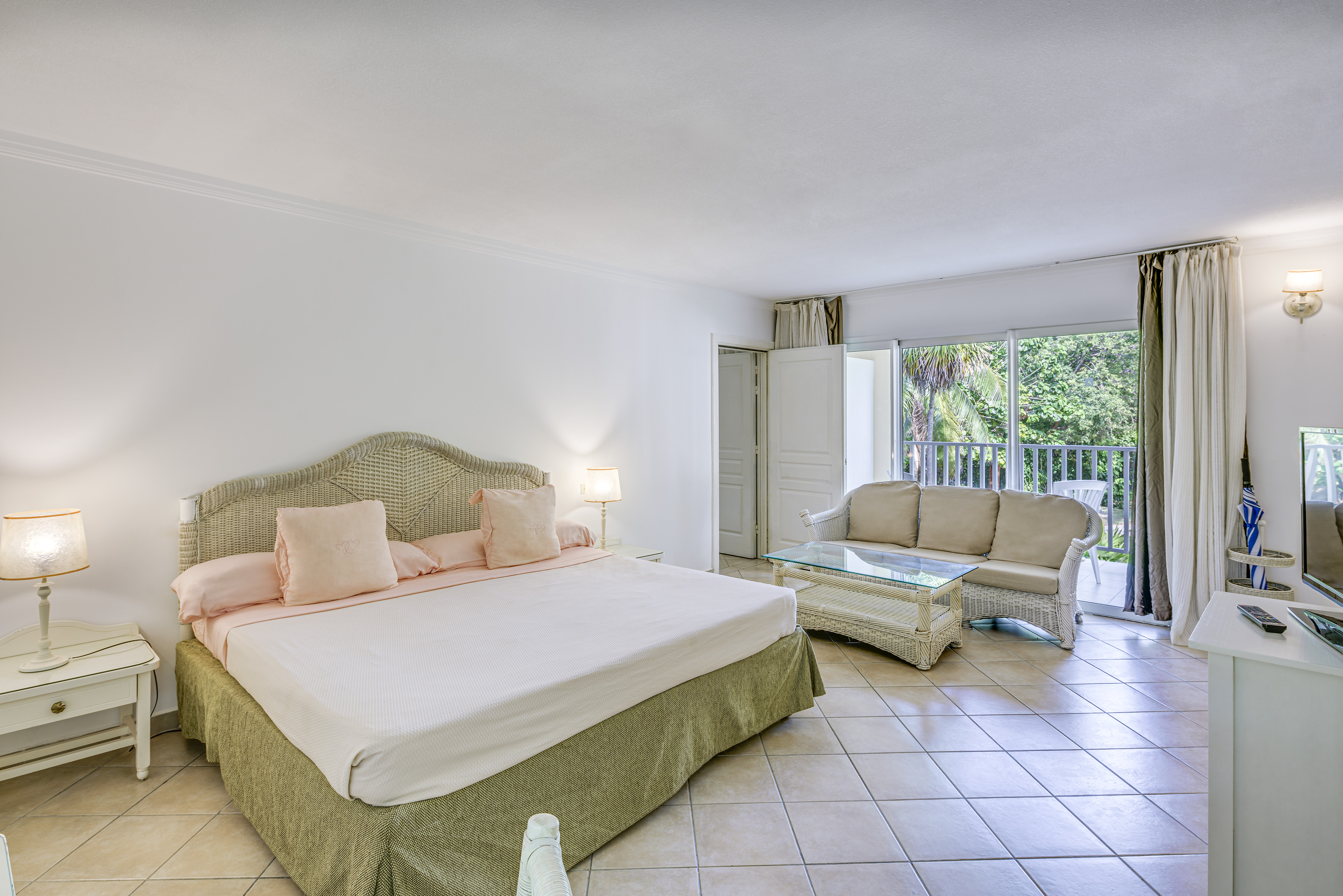 a bedroom with a bed and a couch