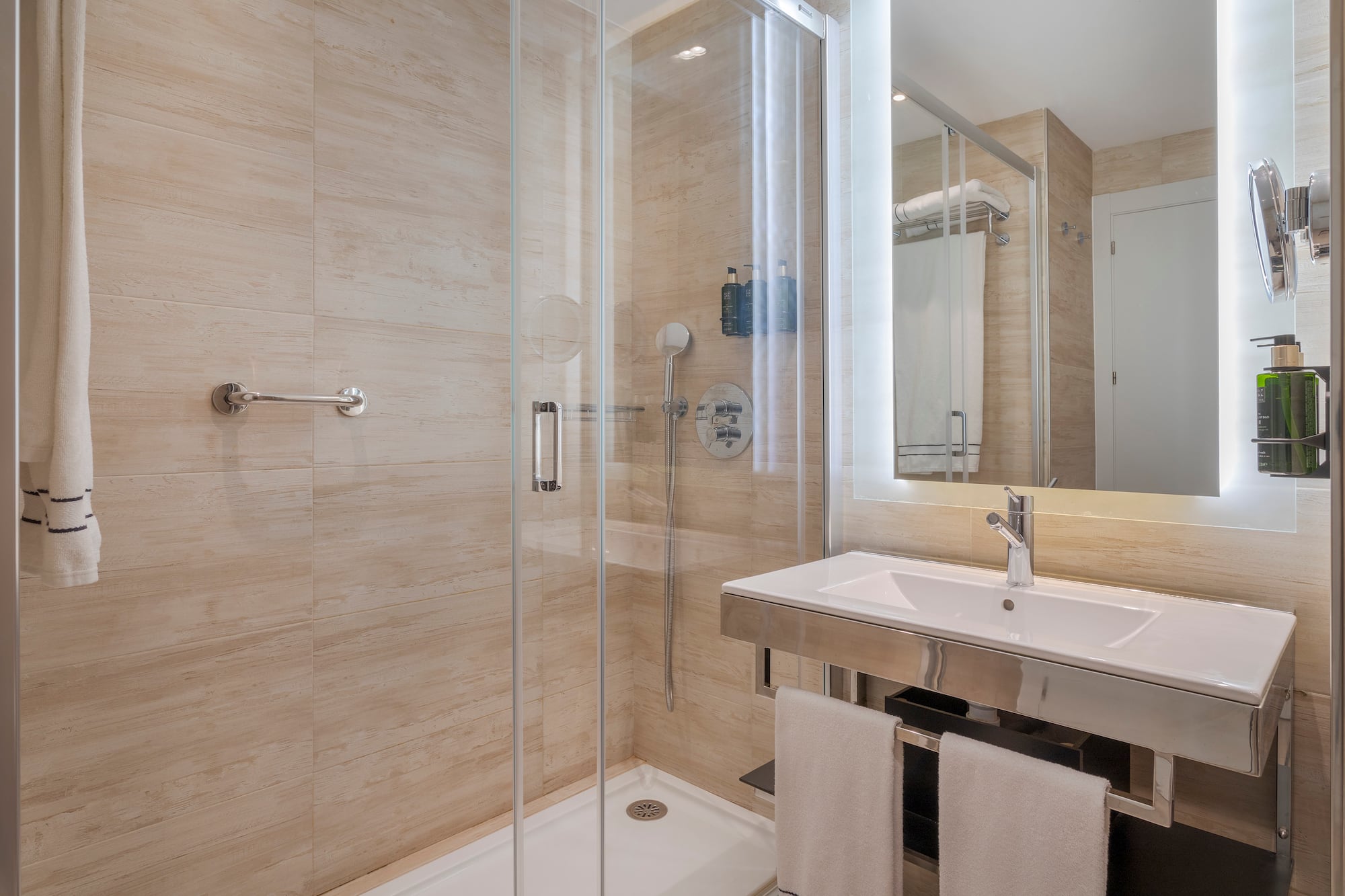 a bathroom with a shower and sink