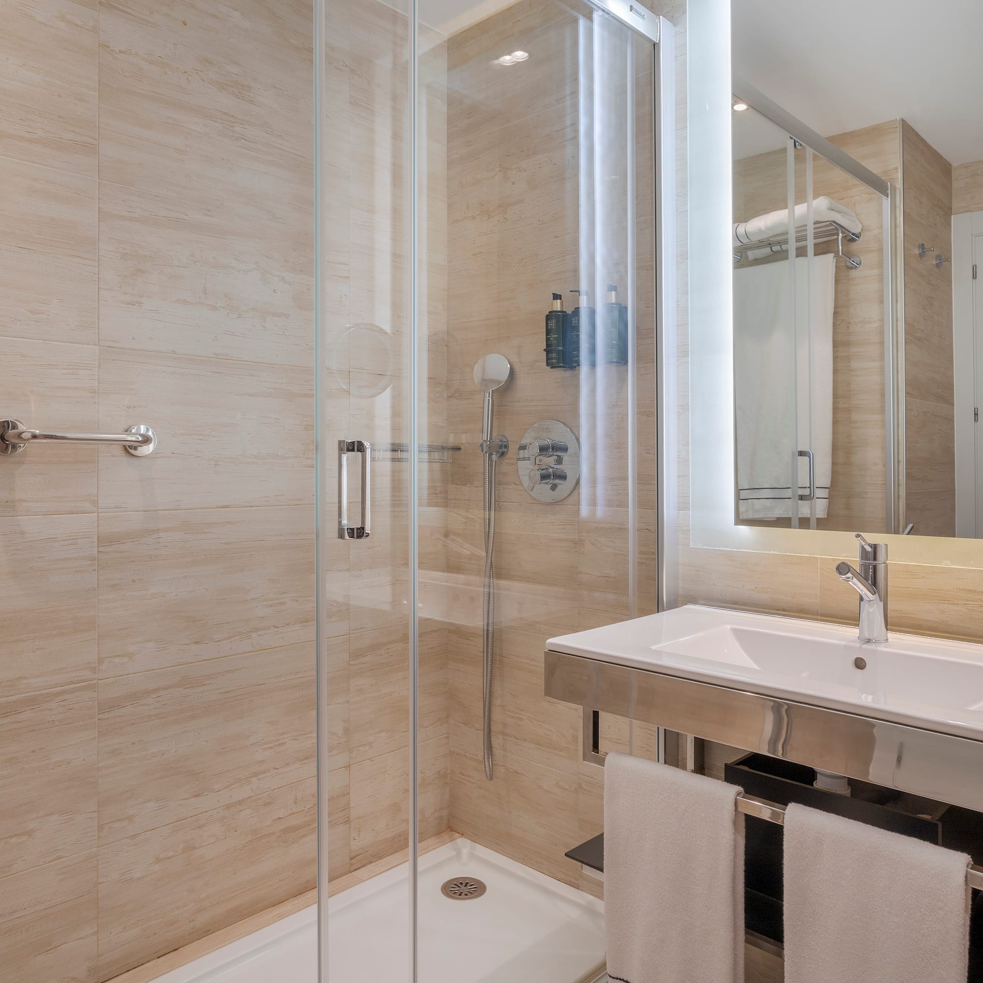 a bathroom with a shower and sink