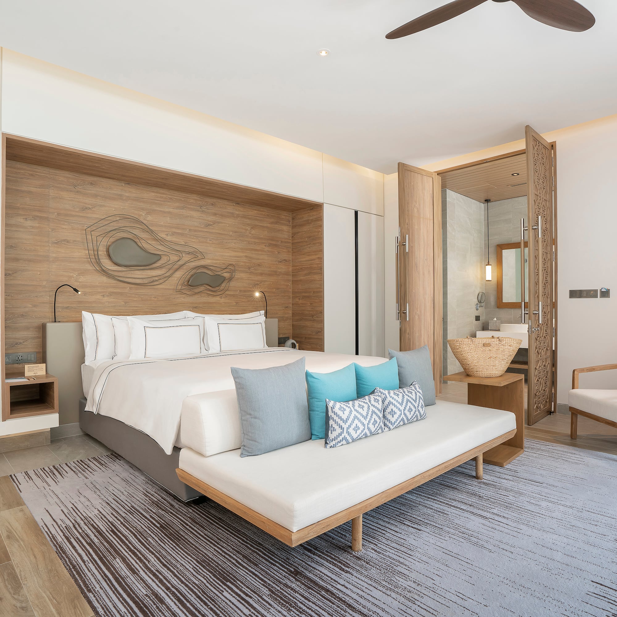 a bedroom with a bed and a fan