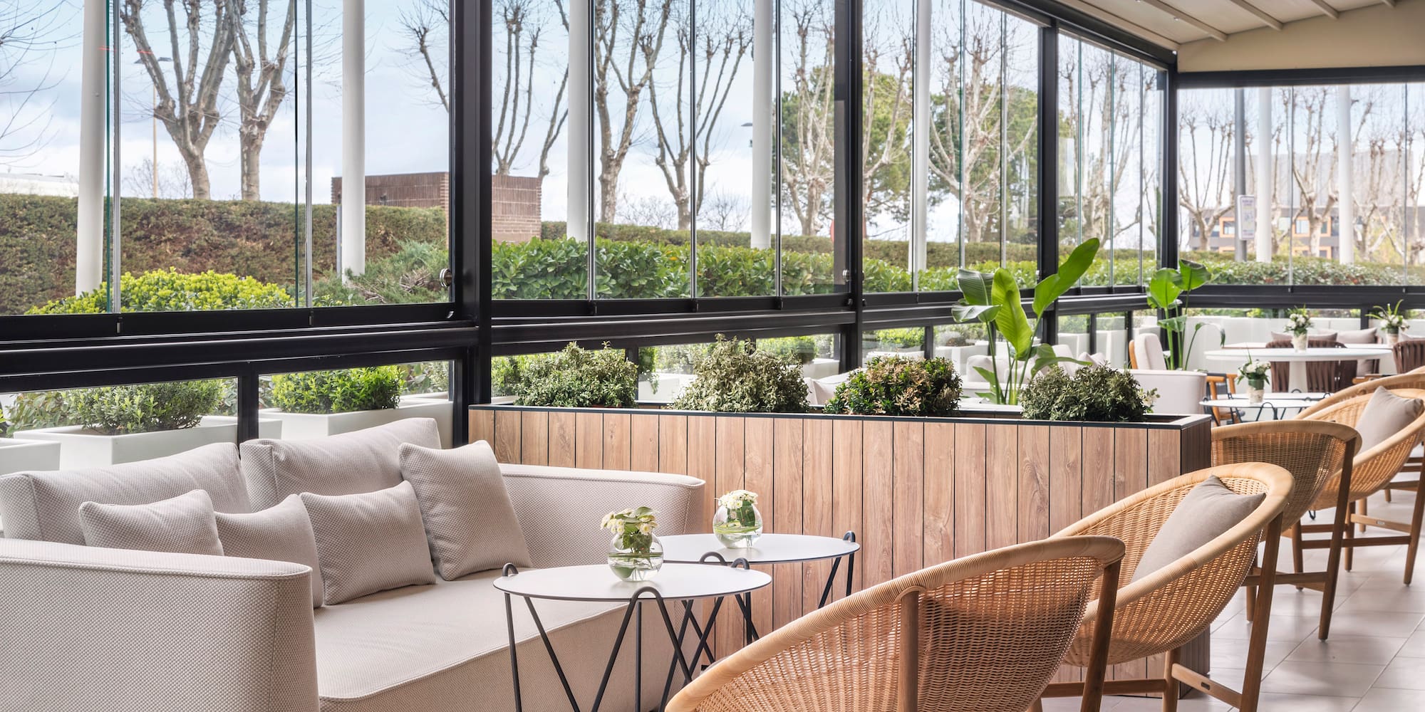 a room with a couch and chairs