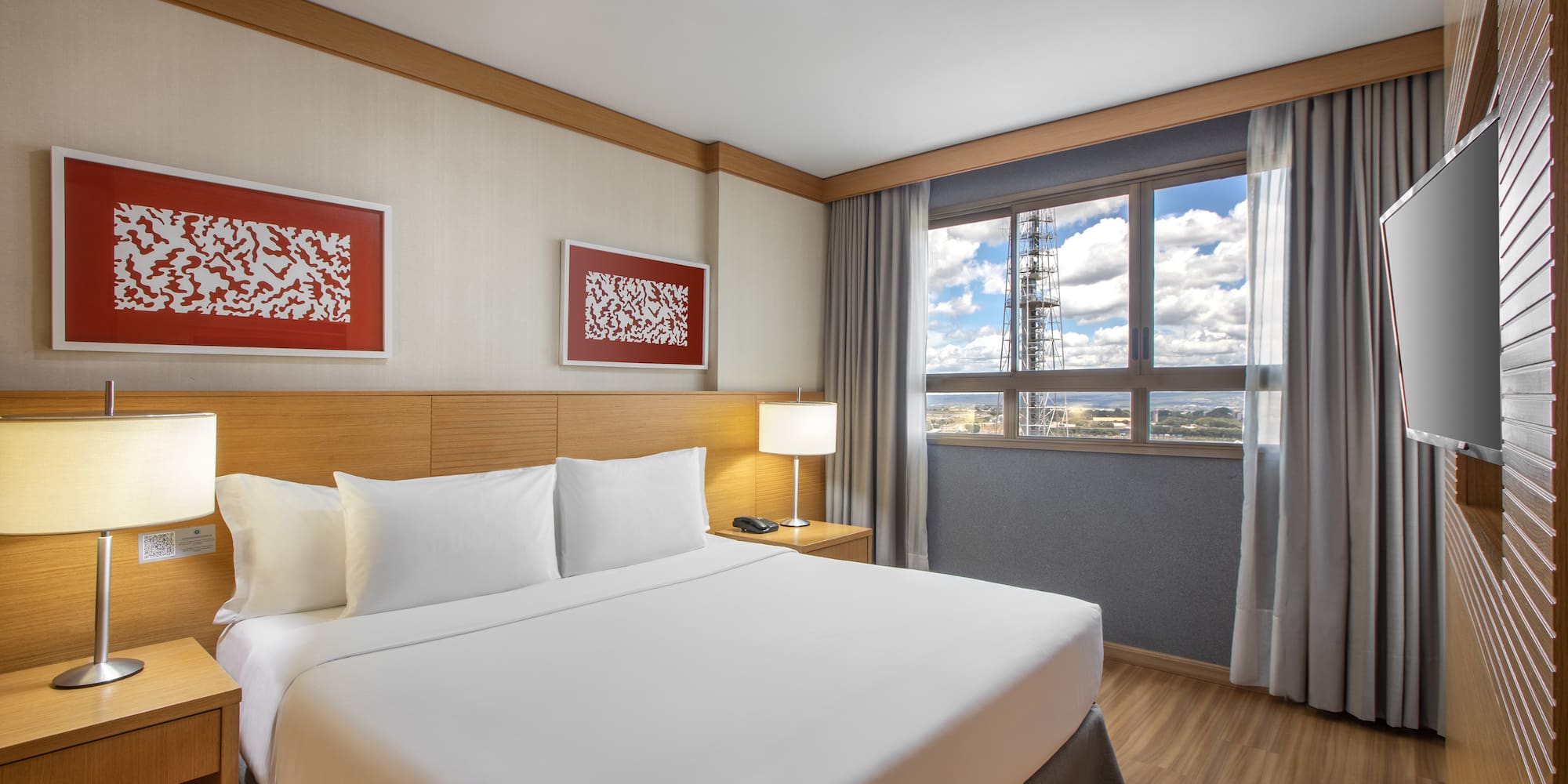 a bedroom with a bed and a lamp