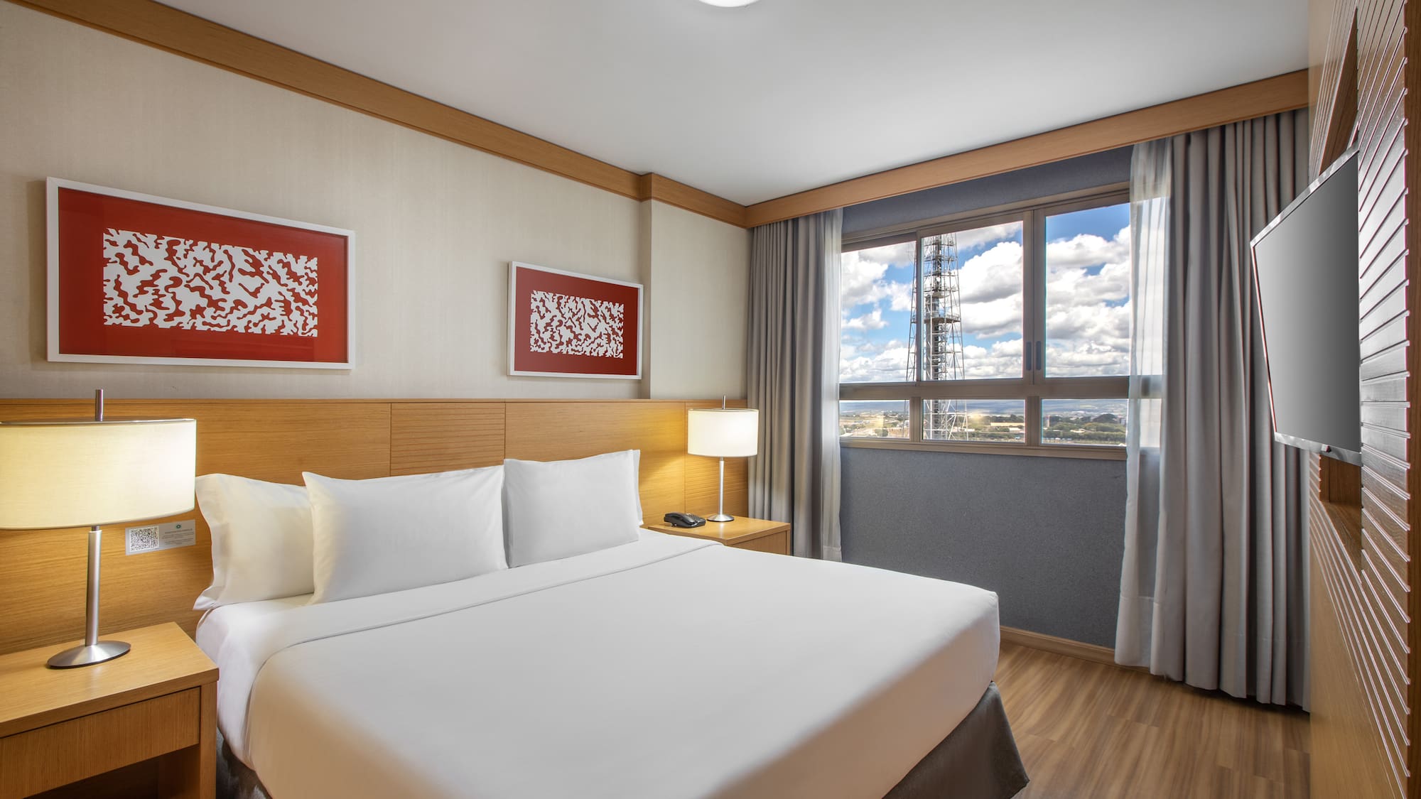 a bedroom with a bed and a lamp