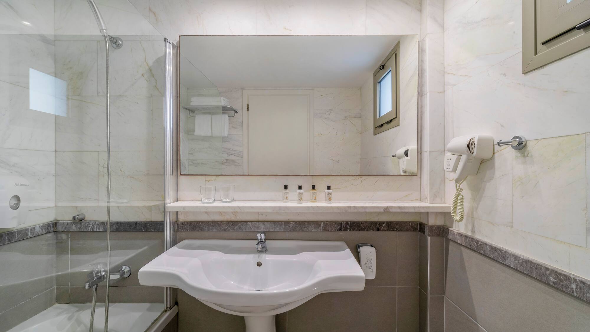 a bathroom with a sink and shower