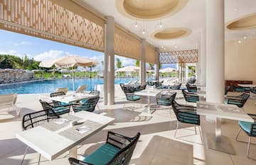 a pool with tables and chairs