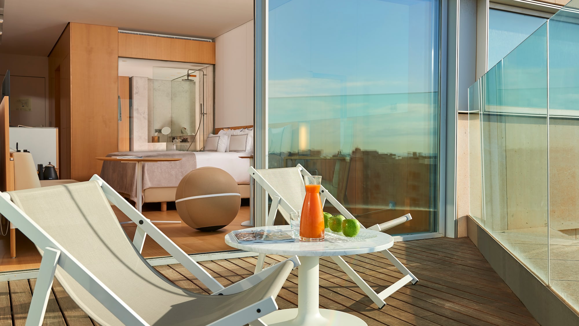 a deck with chairs and a table