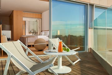 a deck with chairs and a table