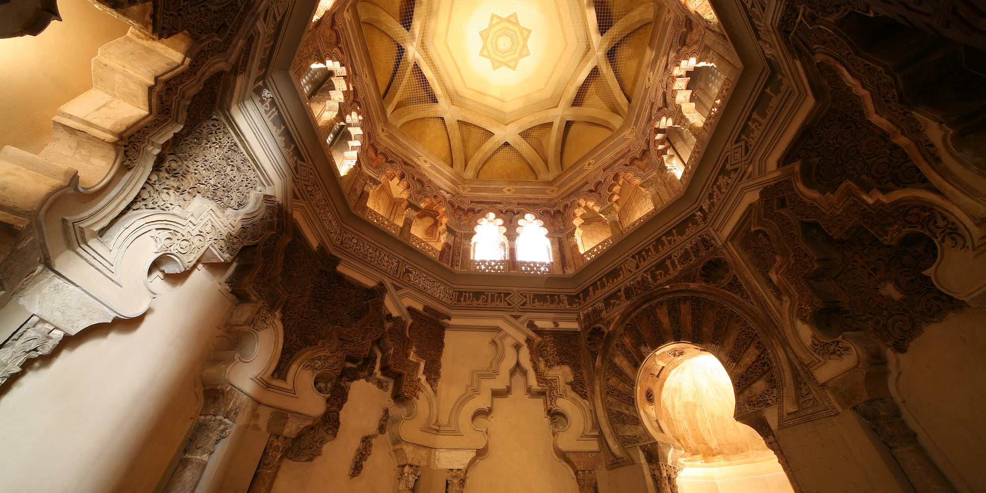 a ceiling with ornate carvings
