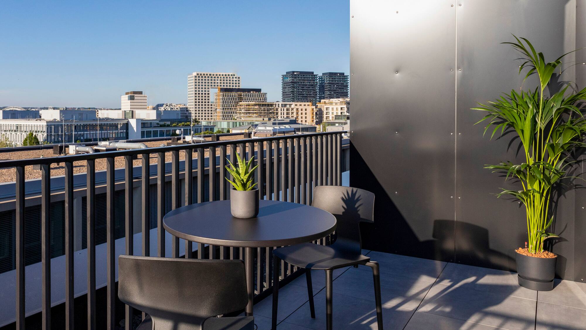 a table and chairs on a balcony