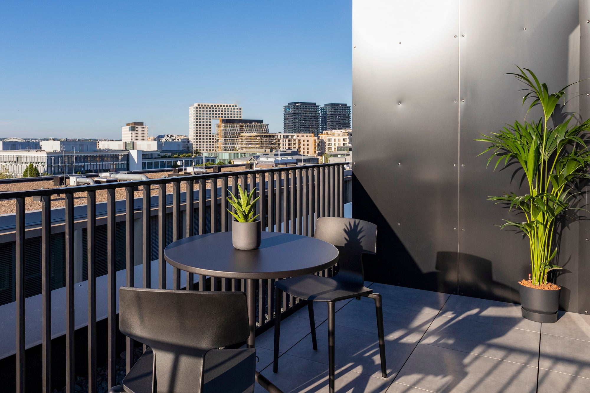 a table and chairs on a balcony