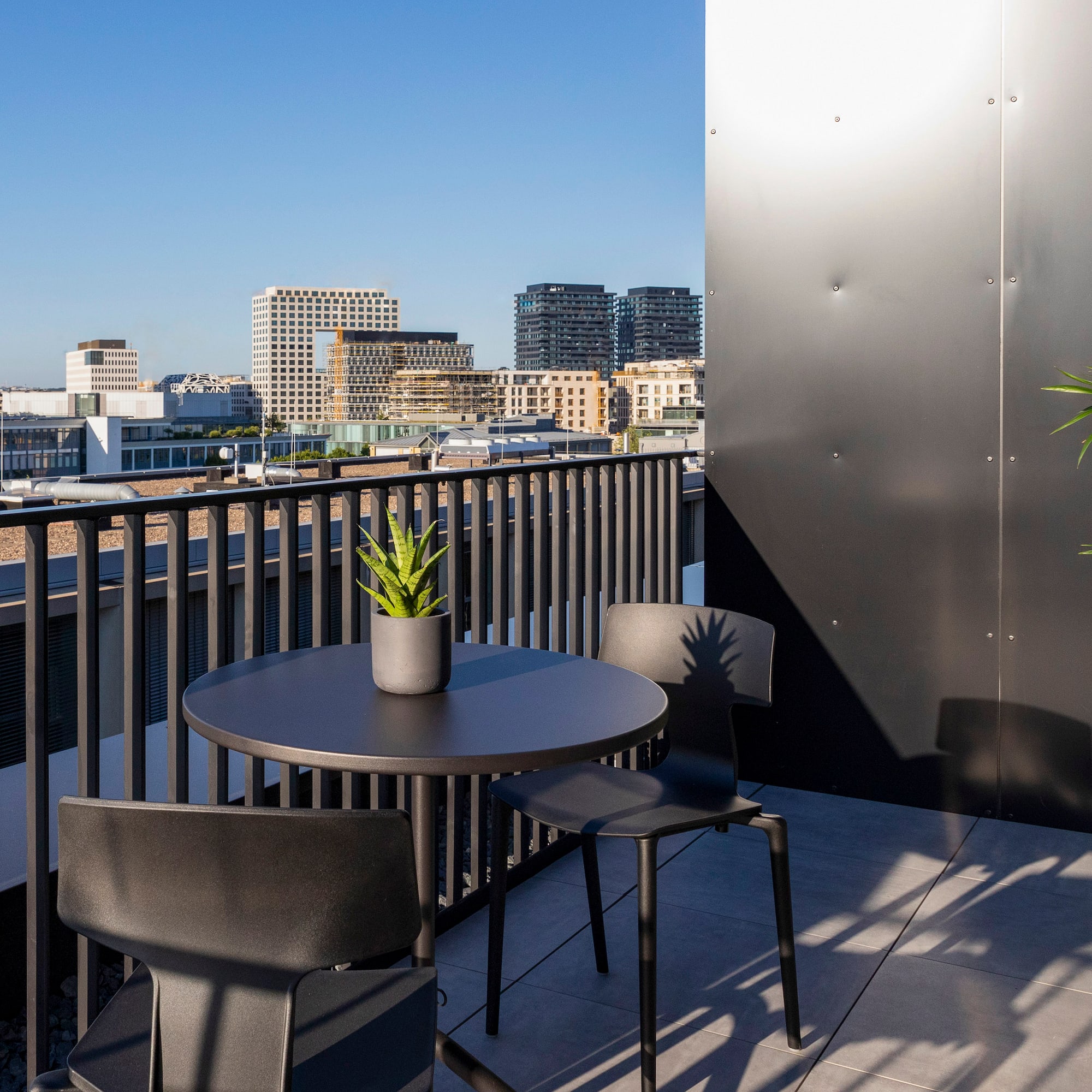 a table and chairs on a balcony