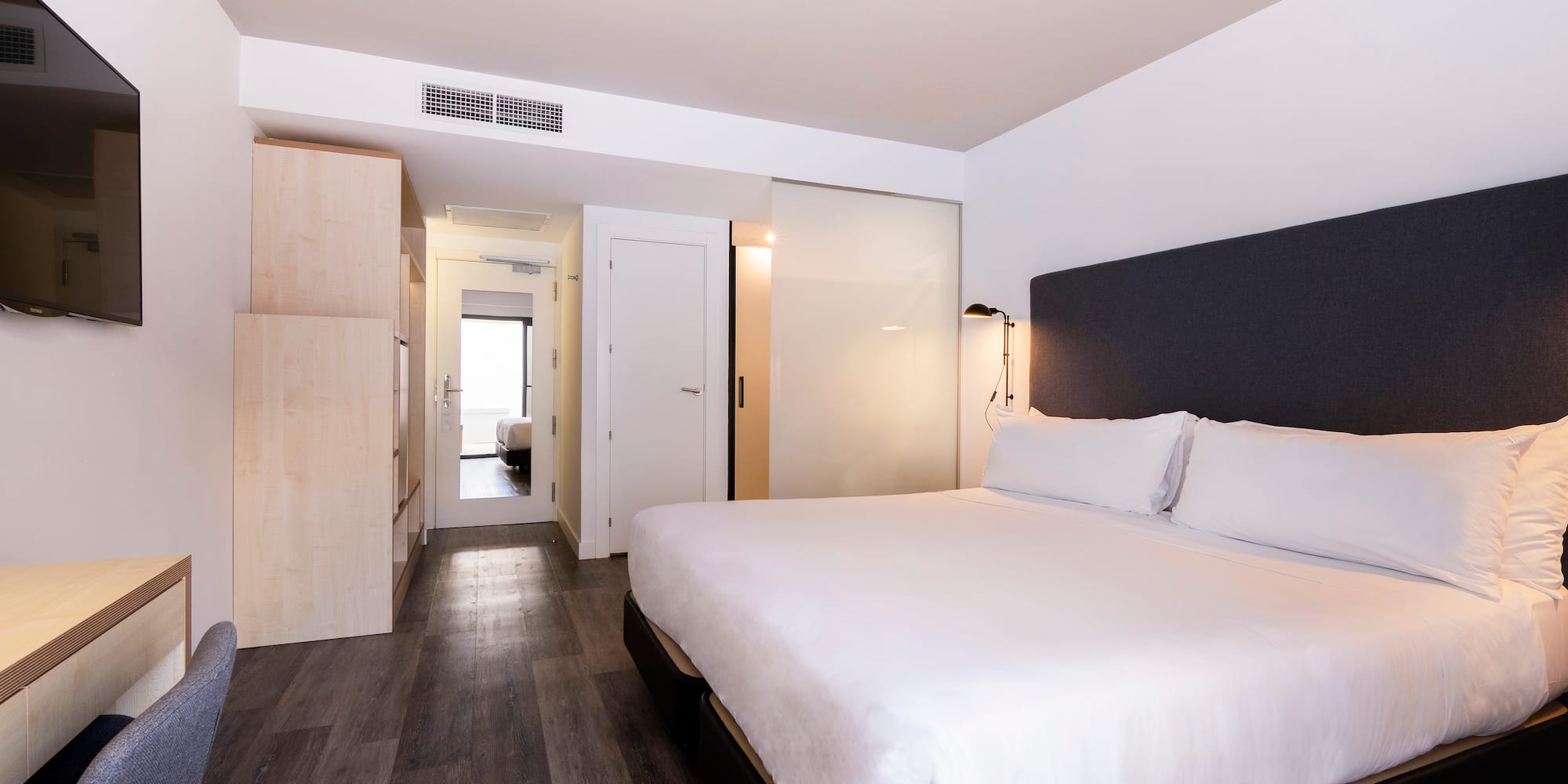 a bedroom with a bed and a closet