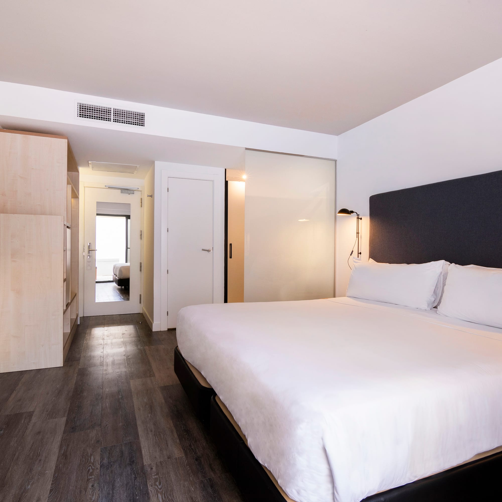 a bedroom with a bed and a closet