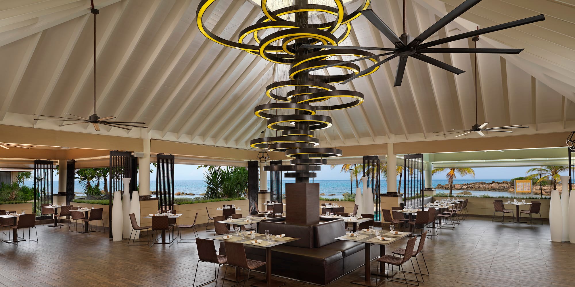 a large room with a large chandelier and chairs
