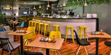 a restaurant with tables and chairs