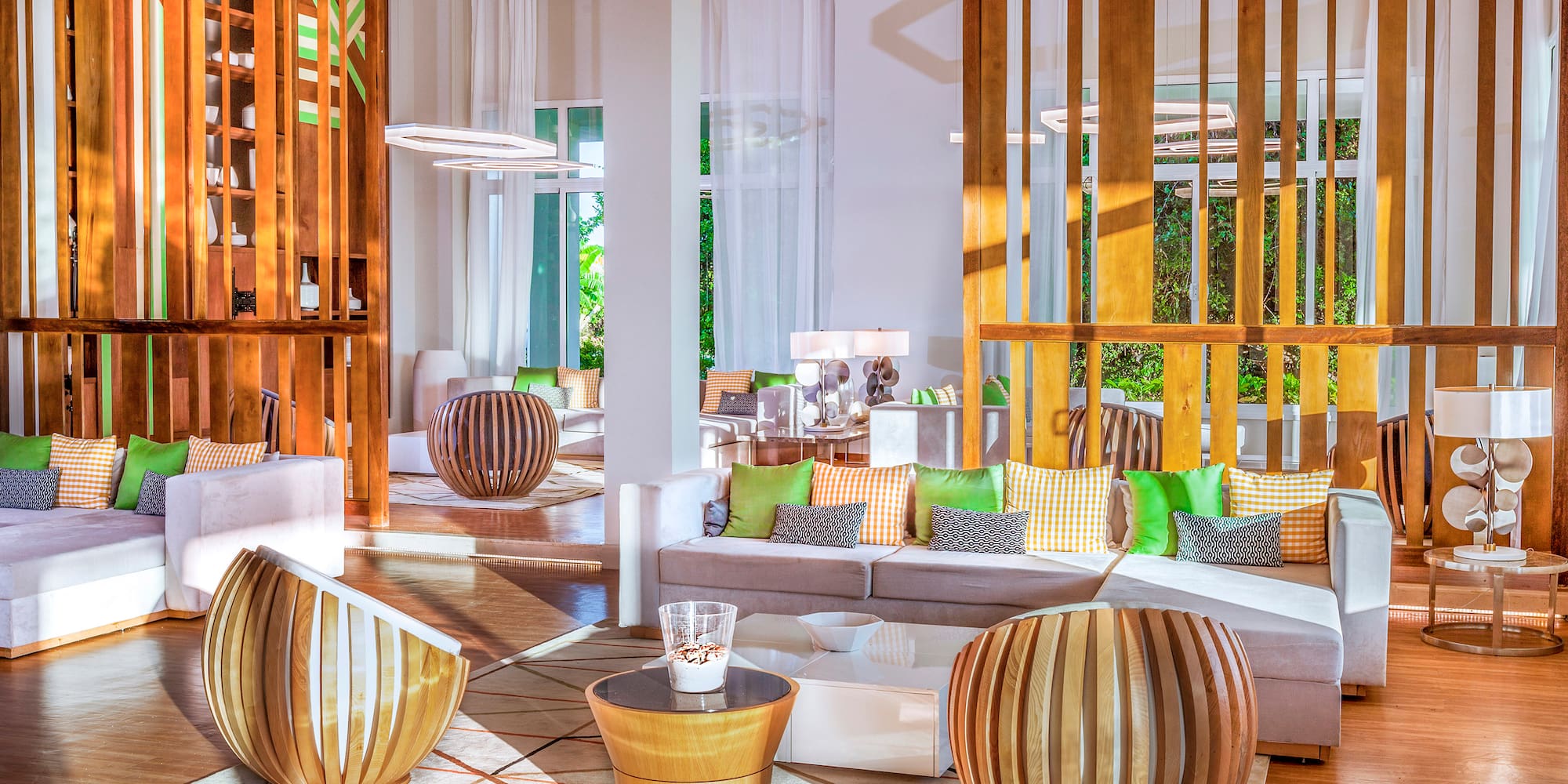 a room with a couch and chairs