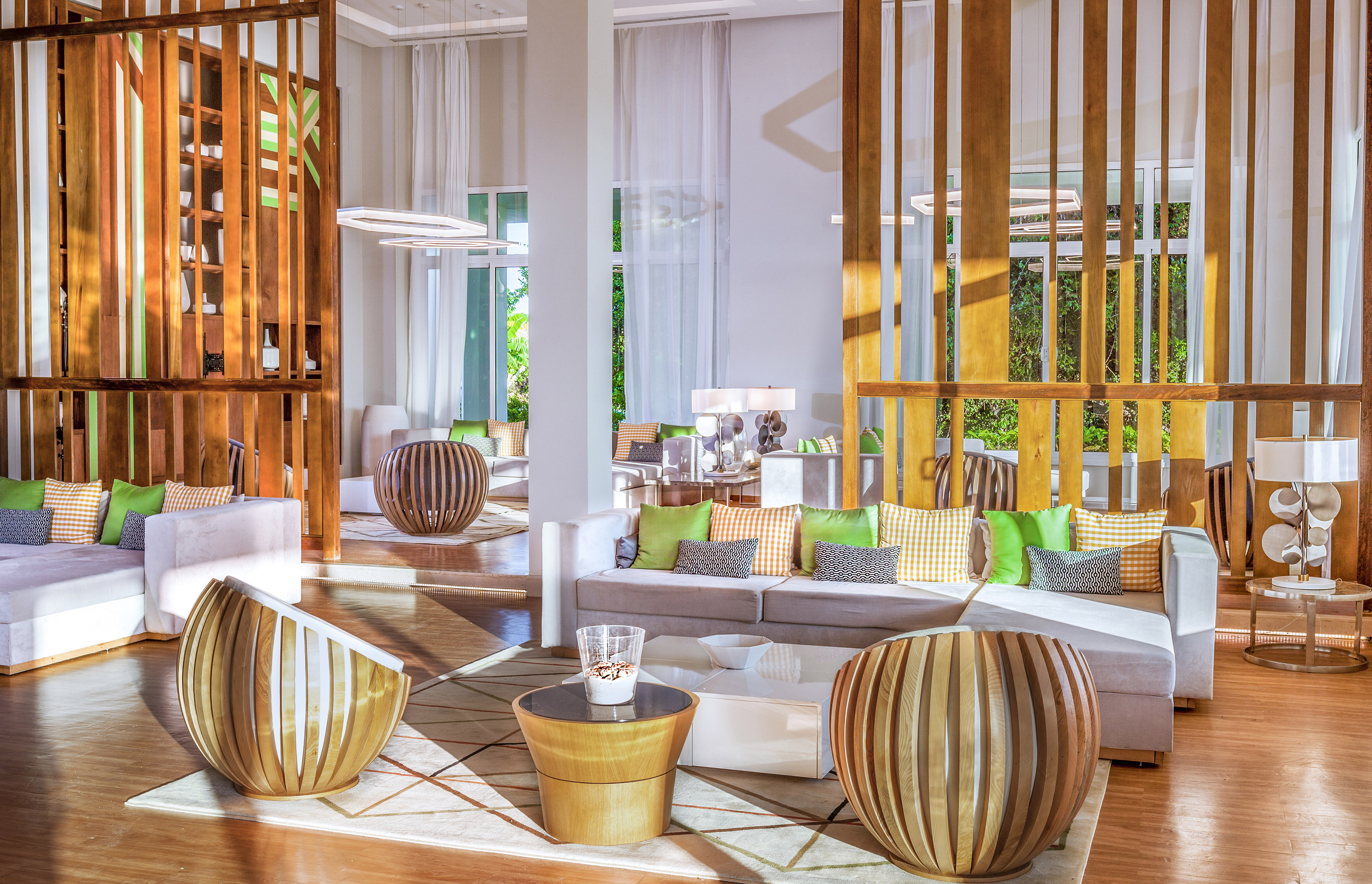 a room with a couch and chairs