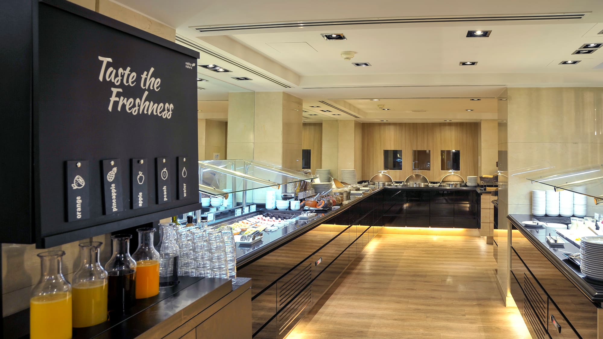 a food court with a black sign