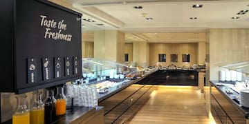 a food court with a black sign