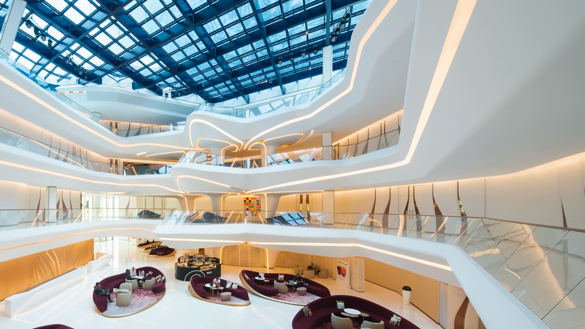 a large white building with a glass roof
