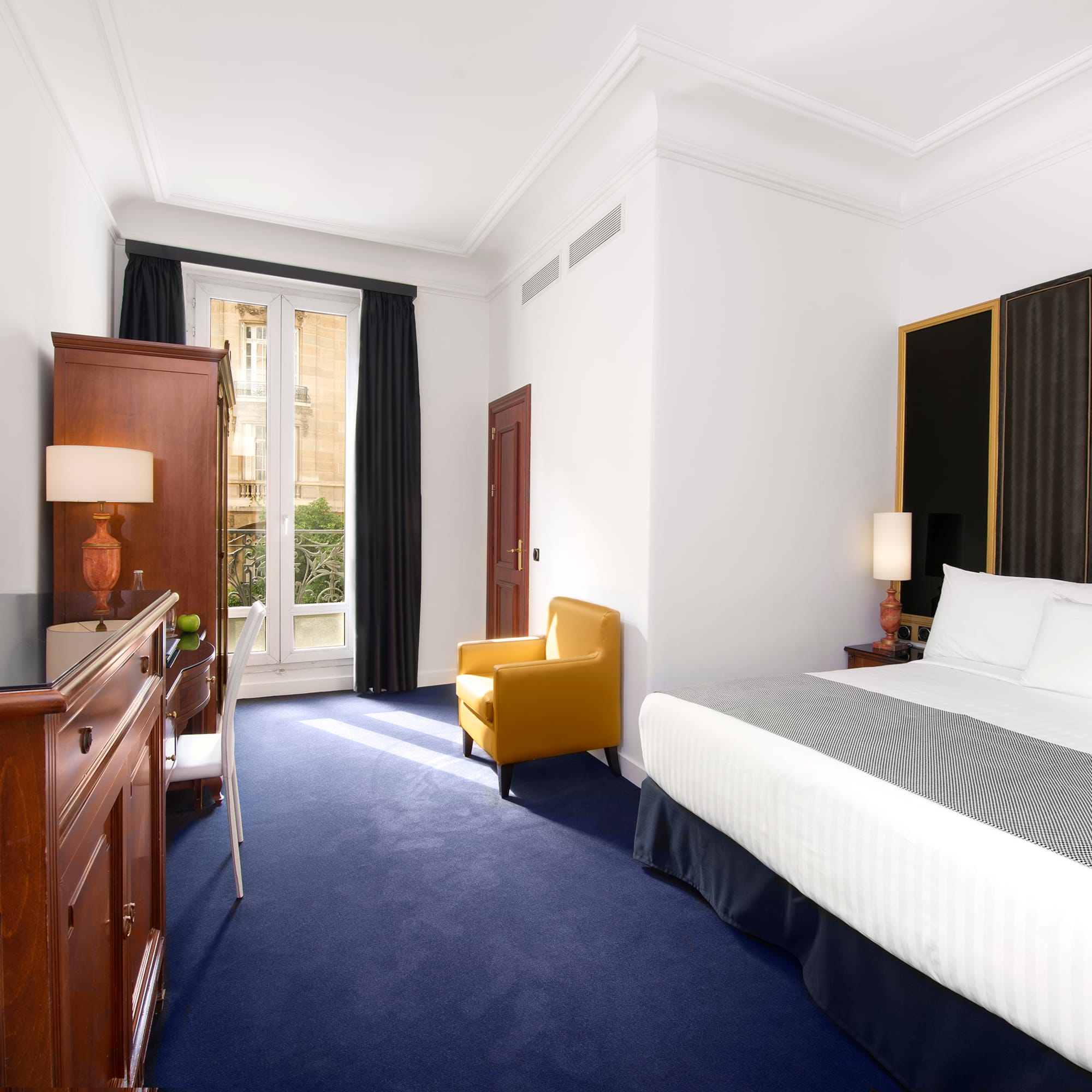 a room with a bed and a chair