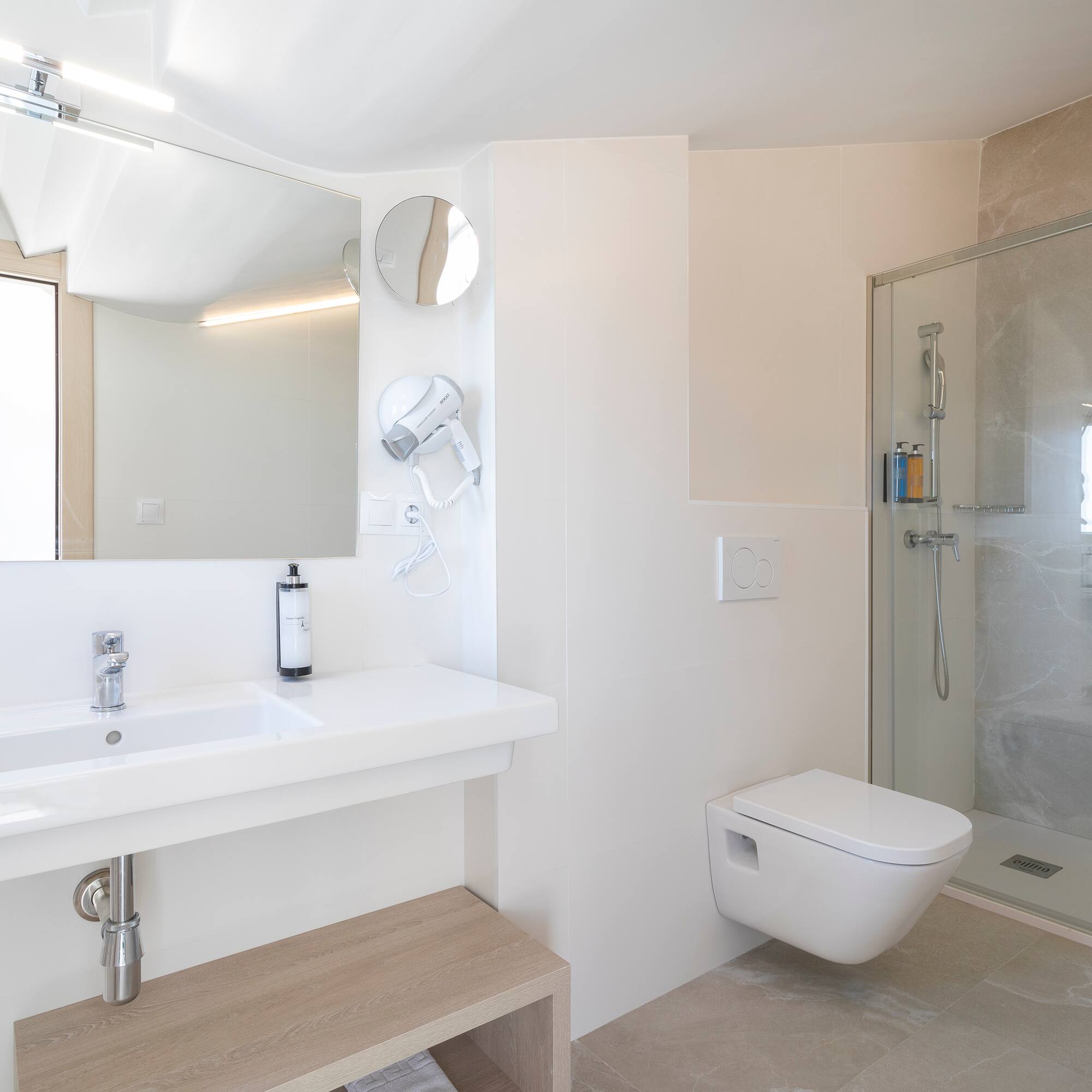 a bathroom with a shower and sink