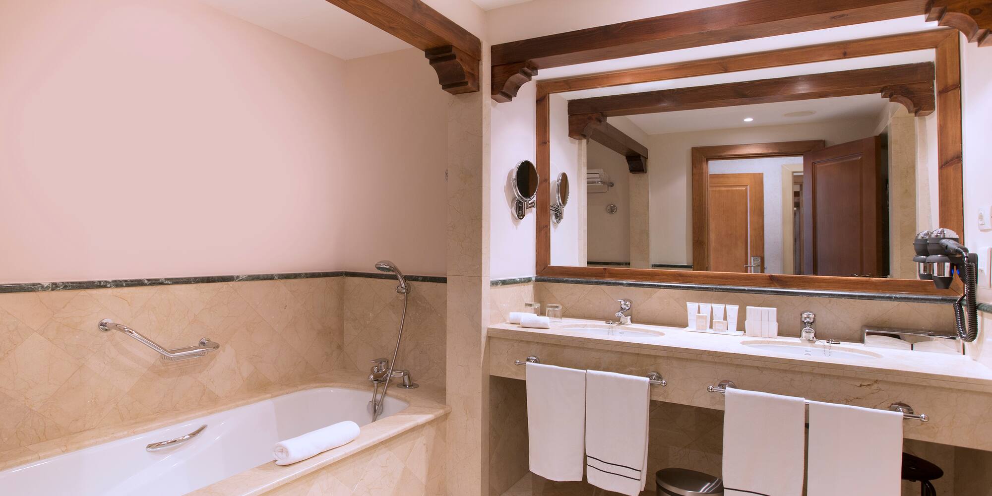 a bathroom with a tub and sink