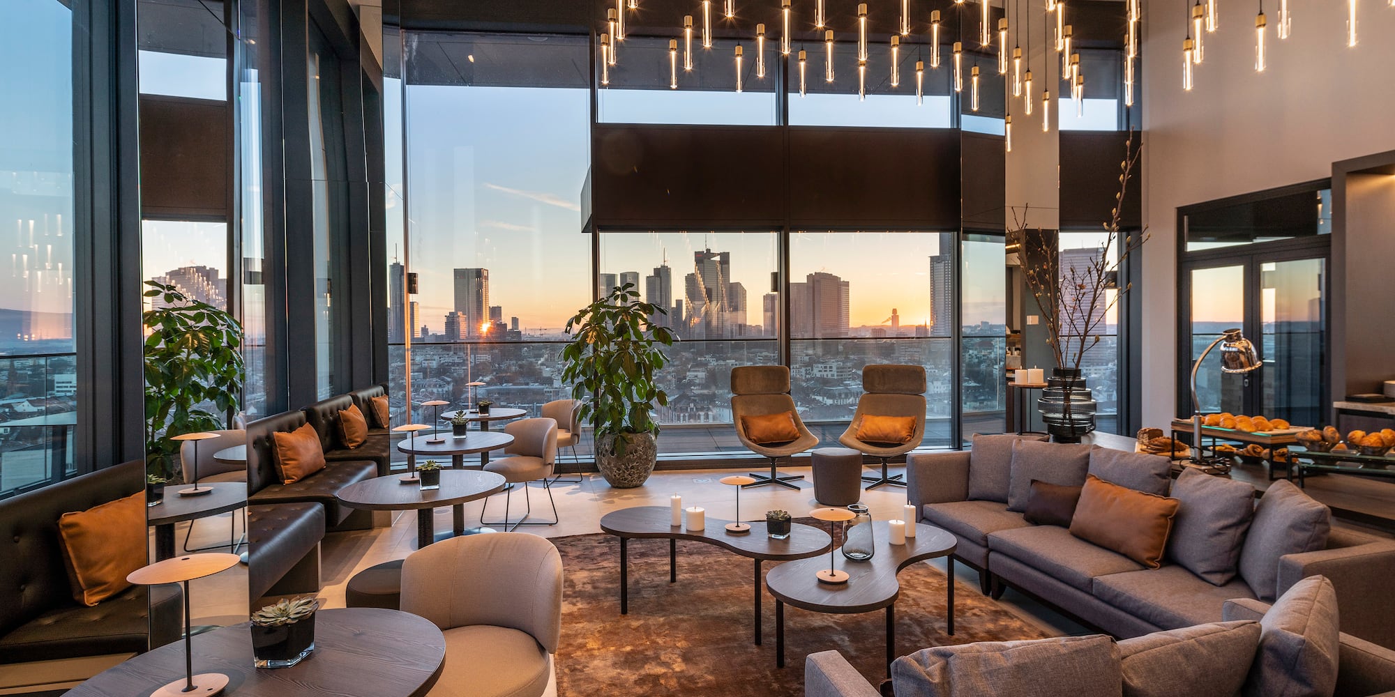 a room with a large window and a large view of a city