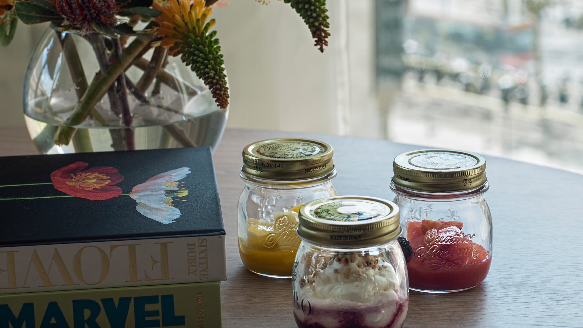 a group of jars with food on a table