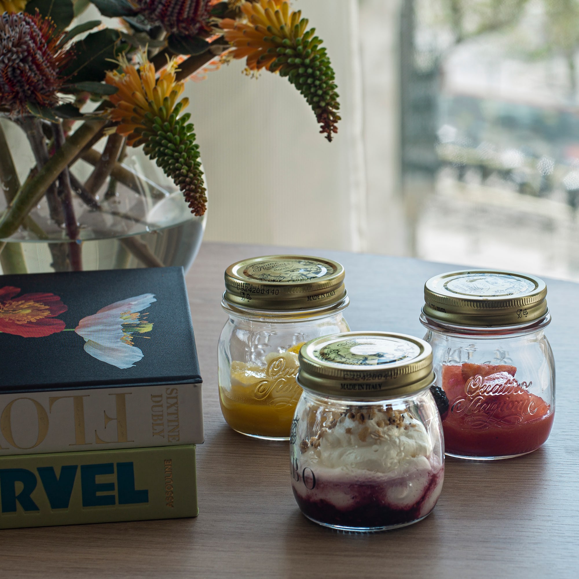 a group of jars with food on a table
