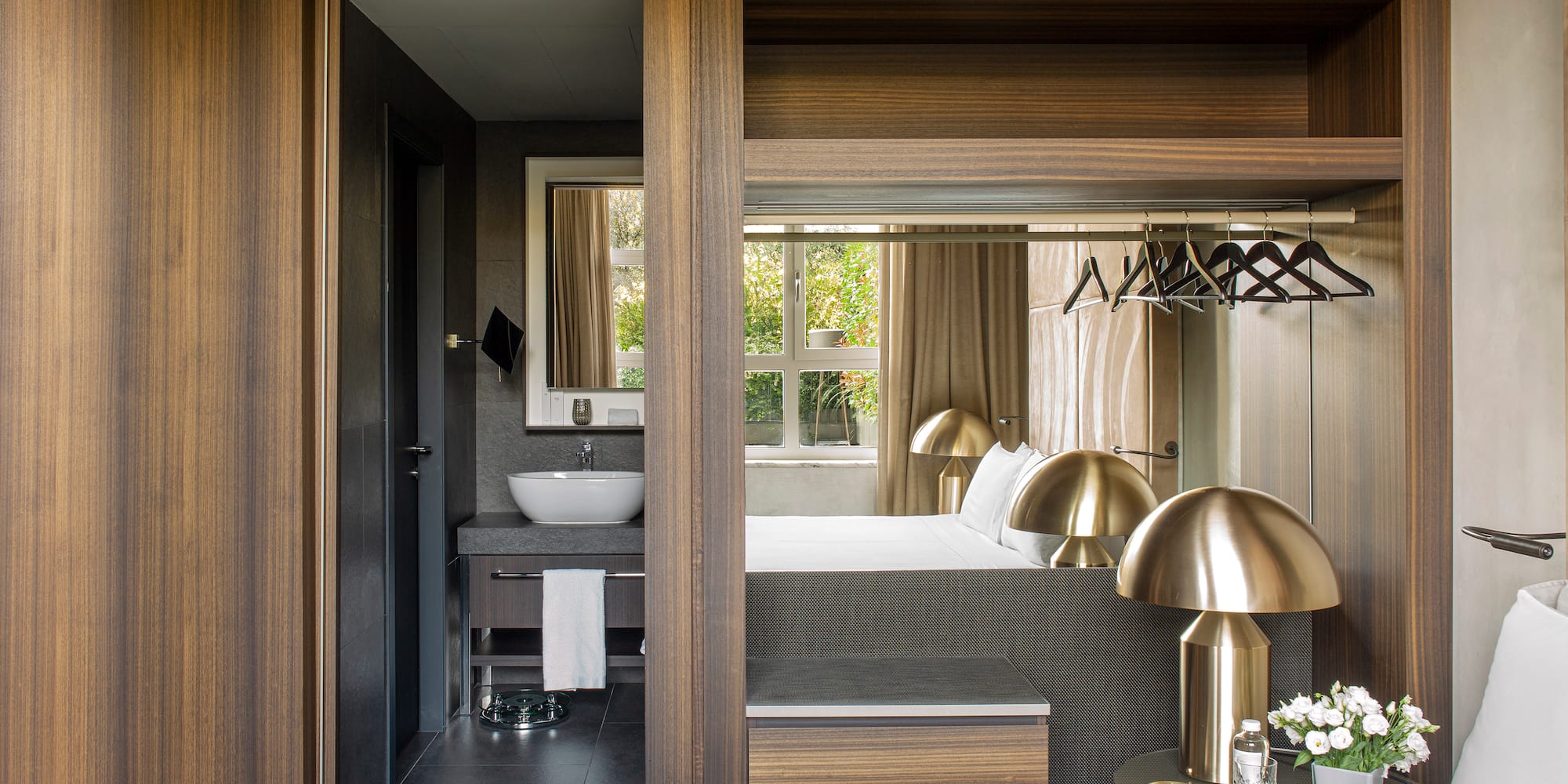 a bedroom with a bed and a sink