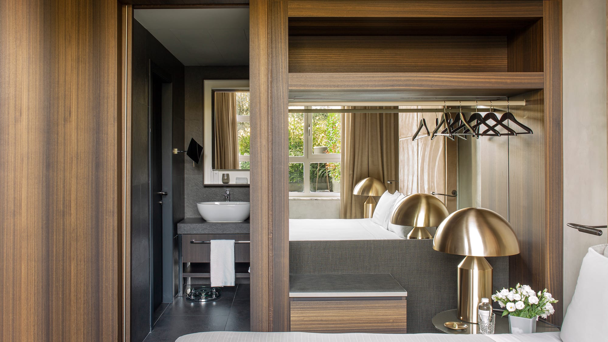 a bedroom with a bed and a sink