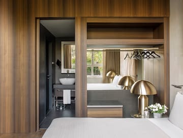 a bedroom with a bed and a sink